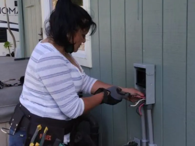 Licensed electrician wiring an exterior subpanel in St. Helena